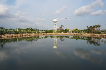 Fototapeta premium green plants and a lake in a small park in Thailand
