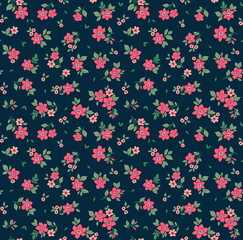 Trendy seamless vector floral pattern. Endless print made of small pink flowers. Summer and spring motifs. Dark blue background. Stock vector illustration.