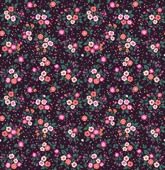 Beautiful vintage floral pattern in small abstract flowers. Small colorful flowers. Dark violet background. Liberty style print. Floral seamless background. The elegant the template for fashion prints