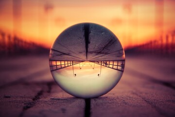 Abstract colorful holiday concept. Reflection of the pier in Gdynia, Poland on a glass ball.