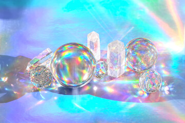 quartz crystals and balls on abstract holographic background. spiritual healing crystal practice,...