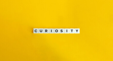 Curiosity Word on Letter Tiles on Yellow Background. Minimal Aesthetics.