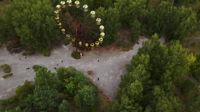 Aerial view of old abandoned Ferris wheel in the amusement park in the ghost town Pripyat Ukraine. Chernobyl nuclear power plant zone of alienation