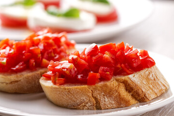 Italian appetizer bruschetta with fresh tomatoes on a plate