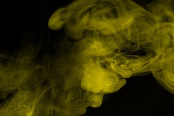 Yellow steam on a black background.
