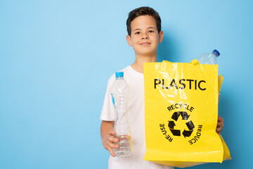 Child boy holding and sorting of plastic bottle in the box for Separation of waste bottle. Recycling concept.