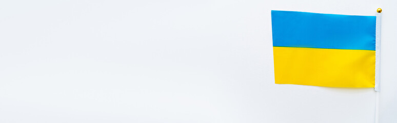 Top view of ukrainian flag on white background, banner.