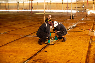 Male worker inspection vacuum test bottom plate tank petrochemical steel weld leak