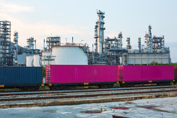 Fototapeta na wymiar Scene of tank oil refinery plant and tower column of petrochemistry industry container on train rail way