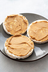 Fototapeta na wymiar Peanut butter and rice cakes sandwich. Healthy protein snack.