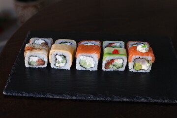 Sushi rolls black background Japanese food