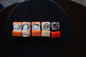 Sushi rolls black background Japanese food
