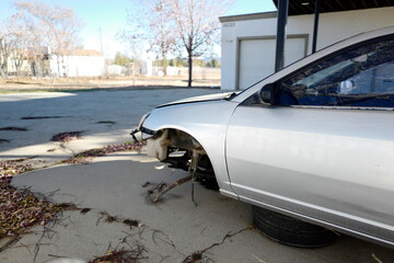 Broken down vehicle with missing tire