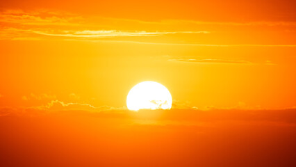 Sun Sunset. Red sky with clouds. Bright sunlight. Beautiful cloudscape.
