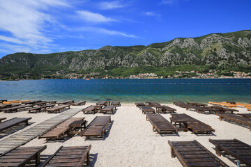 Sun loungers on the beach in Kotor