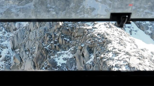 View from moving up Aiguille du Midi cable car in Chamonix, France.