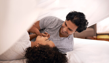 Daytime is playtime. A cute couple underneath the covers.