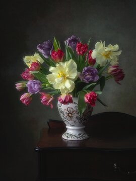 Still life with bouquet of tulips in the interior