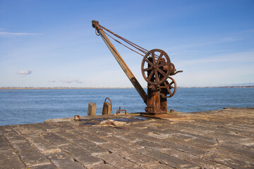 old rusty crane on dockside