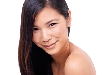Fototapeta premium Charm and innocence. Cropped shot of a beautiful young oriental woman against a white background.