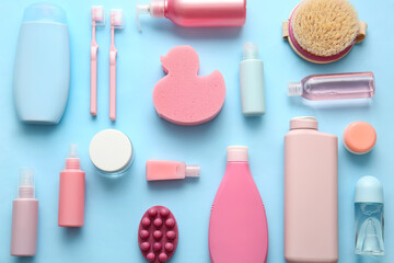 Composition with different cosmetic products, massage brush, bath sponge and toothbrushes on color background