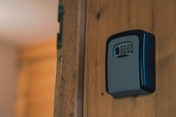 Key lock mounted on a wall or door frame. Number combination lock for receiving door keys when renting an apartment.