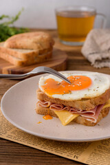 french sandwich croque madame with egg,ham and cheese
