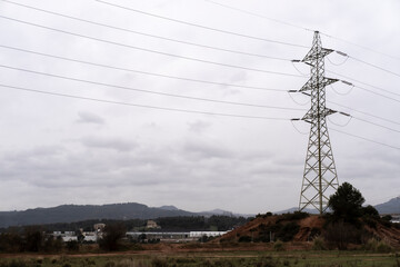 high voltage cable towers in an industrial area in Catalonia