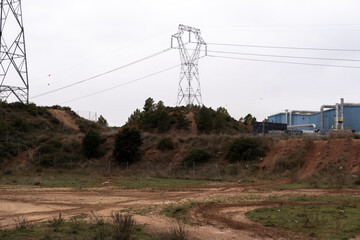 high voltage cable towers in an industrial area in Catalonia