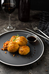 Crispy Accordion Potatoes with sauce and vegetables