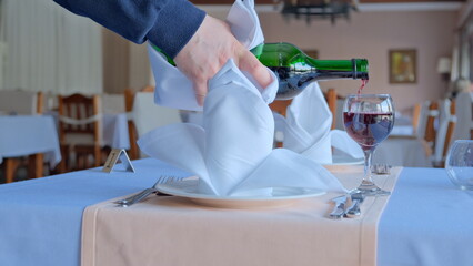 Wine glass fulled in minimal luxury restaurant in hotel prepared for summer time.