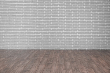 View of grey brick wall in empty room