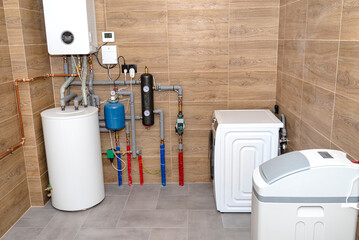 A modern gas boiler room lined with ceramic tiles imitating wood, visible full boiler room...