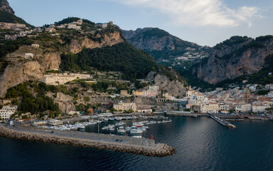 Fototapeta na wymiar Small seaside town on a sunrise (aerial drone photo). Mediterranean, Amalfi, Italy