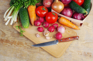 Fresh vegetables on the kitchen board. Close-up.
