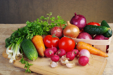 Fresh vegetables on the kitchen board. Close-up.
