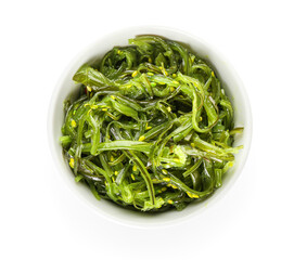 Bowl with healthy seaweed salad on white background