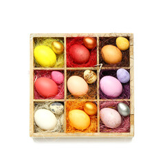 Box with painted Easter eggs on white background
