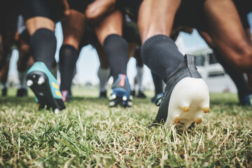 All together now. Low angle shot of two unrecognizable rugby teams competing in a scrum during a rugby match on a field. - obrazy, fototapety, plakaty