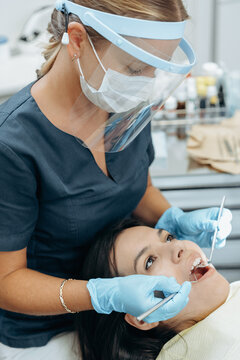 Dentist and patient in dentist office