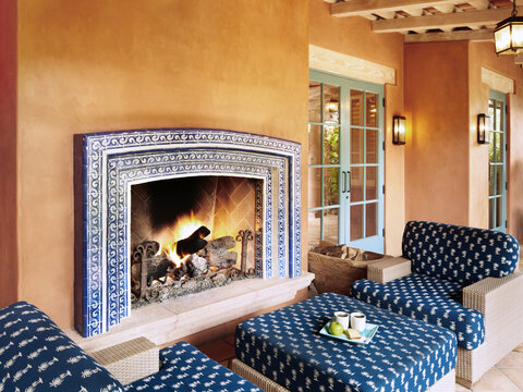 Spanish tiled fireplace and lounge at luxury resort