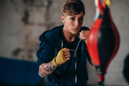 Female boxer training in gym