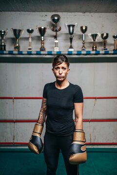 Confident female fighter looking at camera