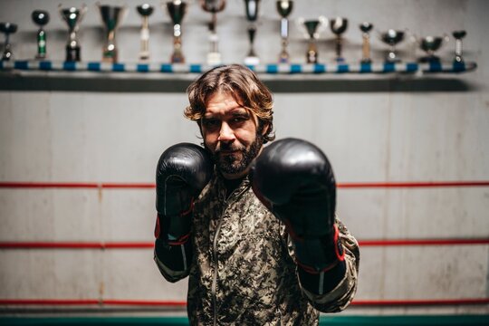 Focused male boxer standing in stance