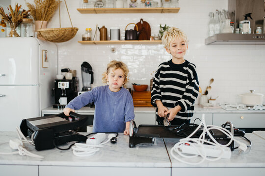 Kids having fun time with electrical appliances