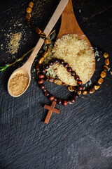 Christian cross necklace on dark background - as a symbol of the beginning of Great Lent, Ash...