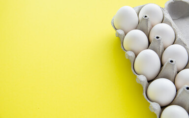 white eggs on yellow background 