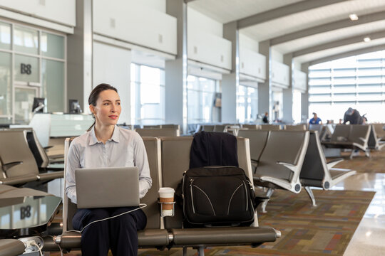 Business Woman Working on Laptop with Copyspace