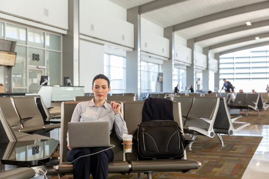 Business Woman Working While Waiting for Flight