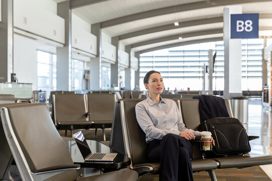 Business Woman Waits for Flight